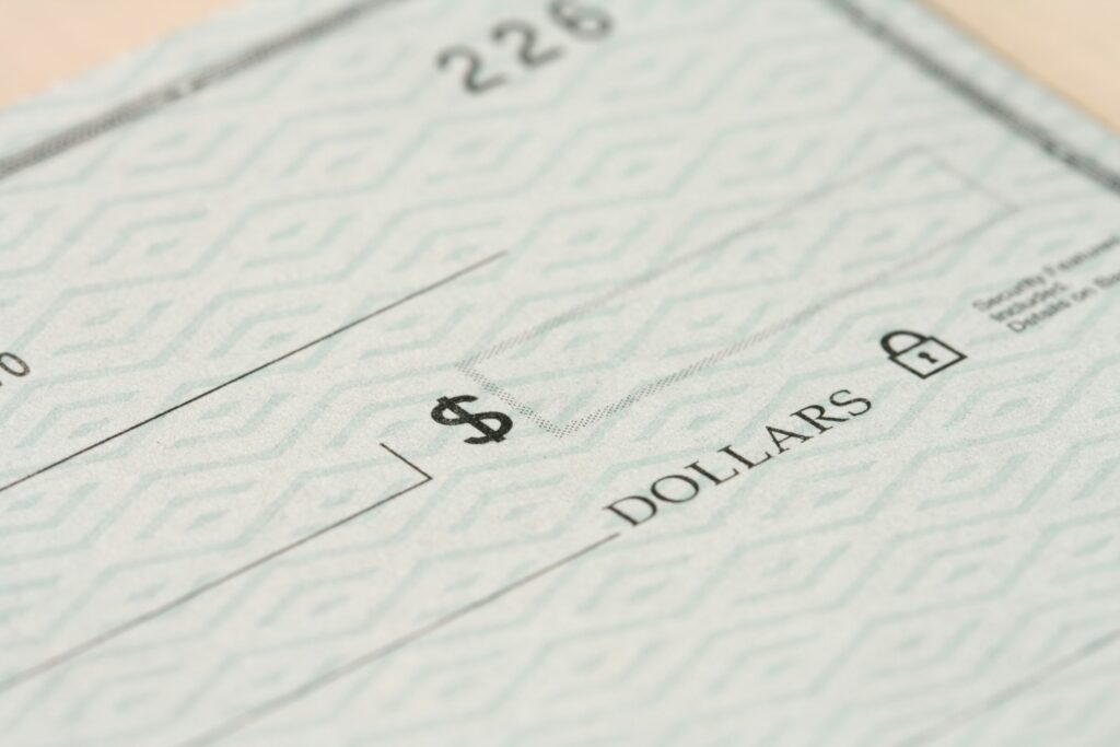 What Happens If a Check Bounces? guide to returned-check fees, bank notifications, account impacts, payment solutions, and financial precautions.