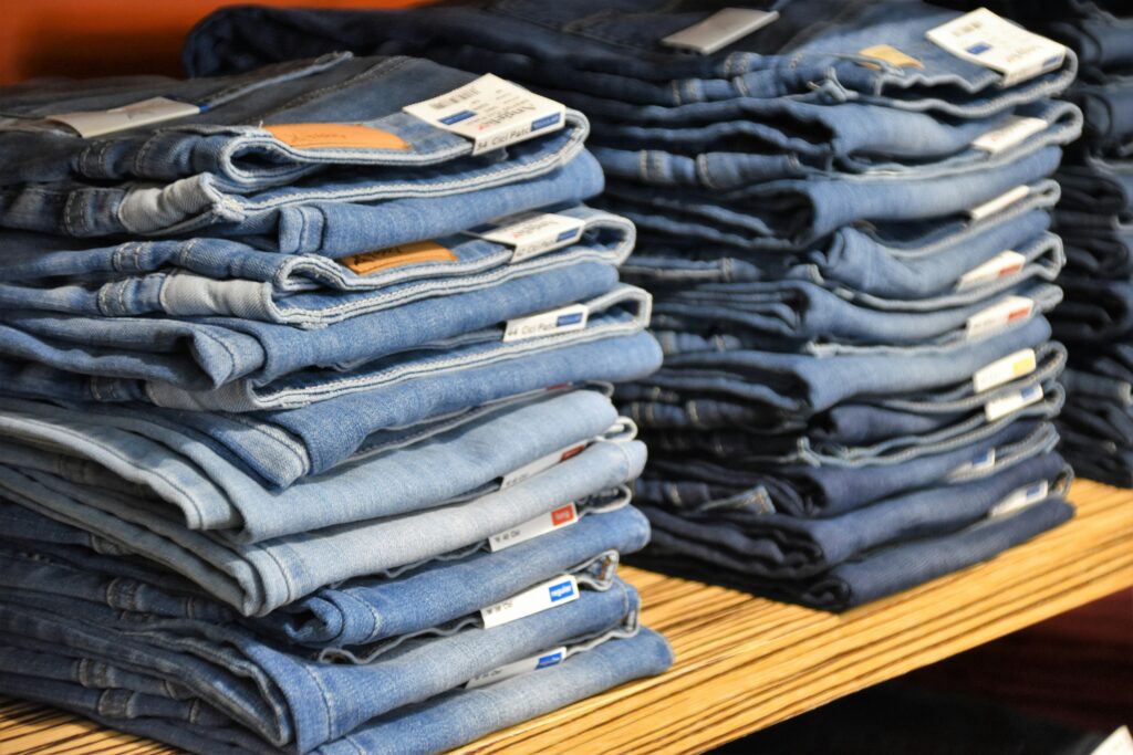 How to Hem Jeans by Hand covering jean measurement, folding, pinning, hand stitching, needle selection, and neat finishing techniques.